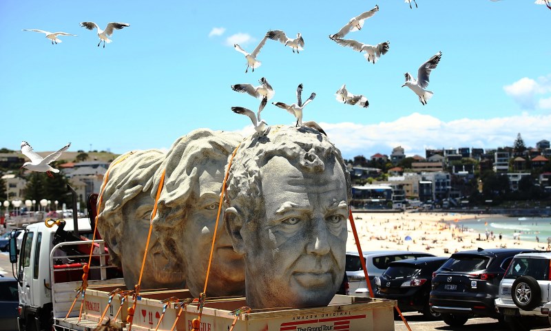 Giant stone heads of The Grand Tour presenters Jeremy Clarkson, James May and Richard Hammond brought Sydney to a standstill today as they were transported through the city on a hiab truck, raising speculation that a colossal statue could be erected somewhere in the country. The Grand Tour will launch on Amazon's Prime Video in Australia and more than 200 countries and territories around the world this month.