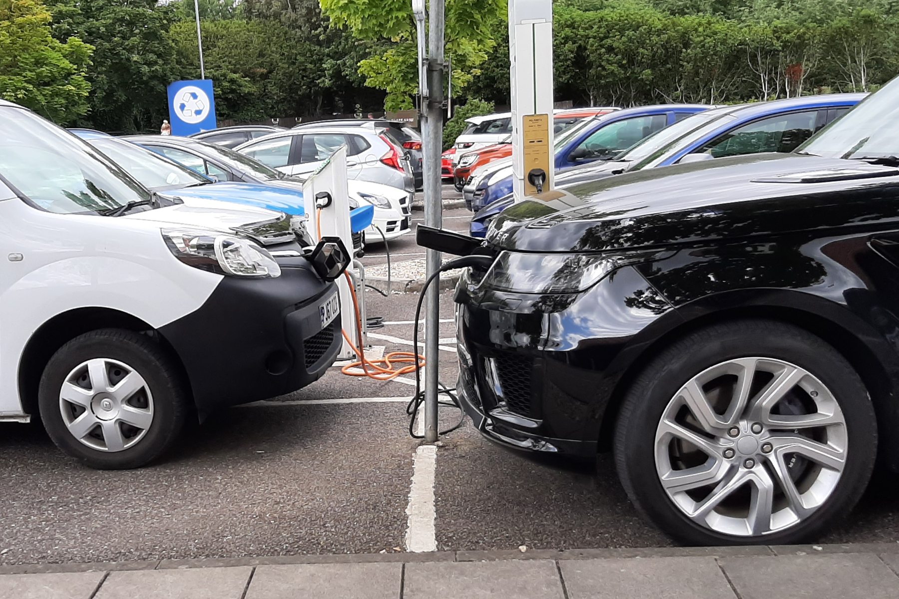 Cars recharging at supermarket - Gareth Herincx